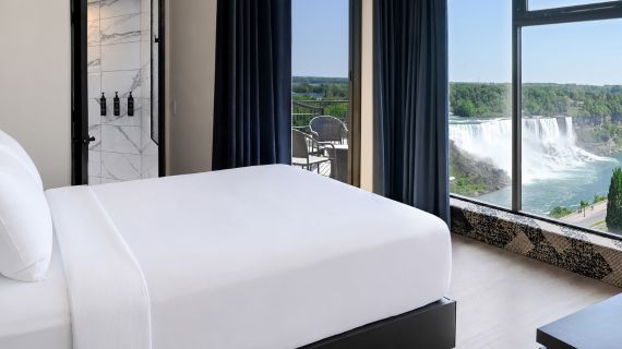 Queen Fallsview Corner Suite Bedroom at The Brock Niagara Falls-Fallsview